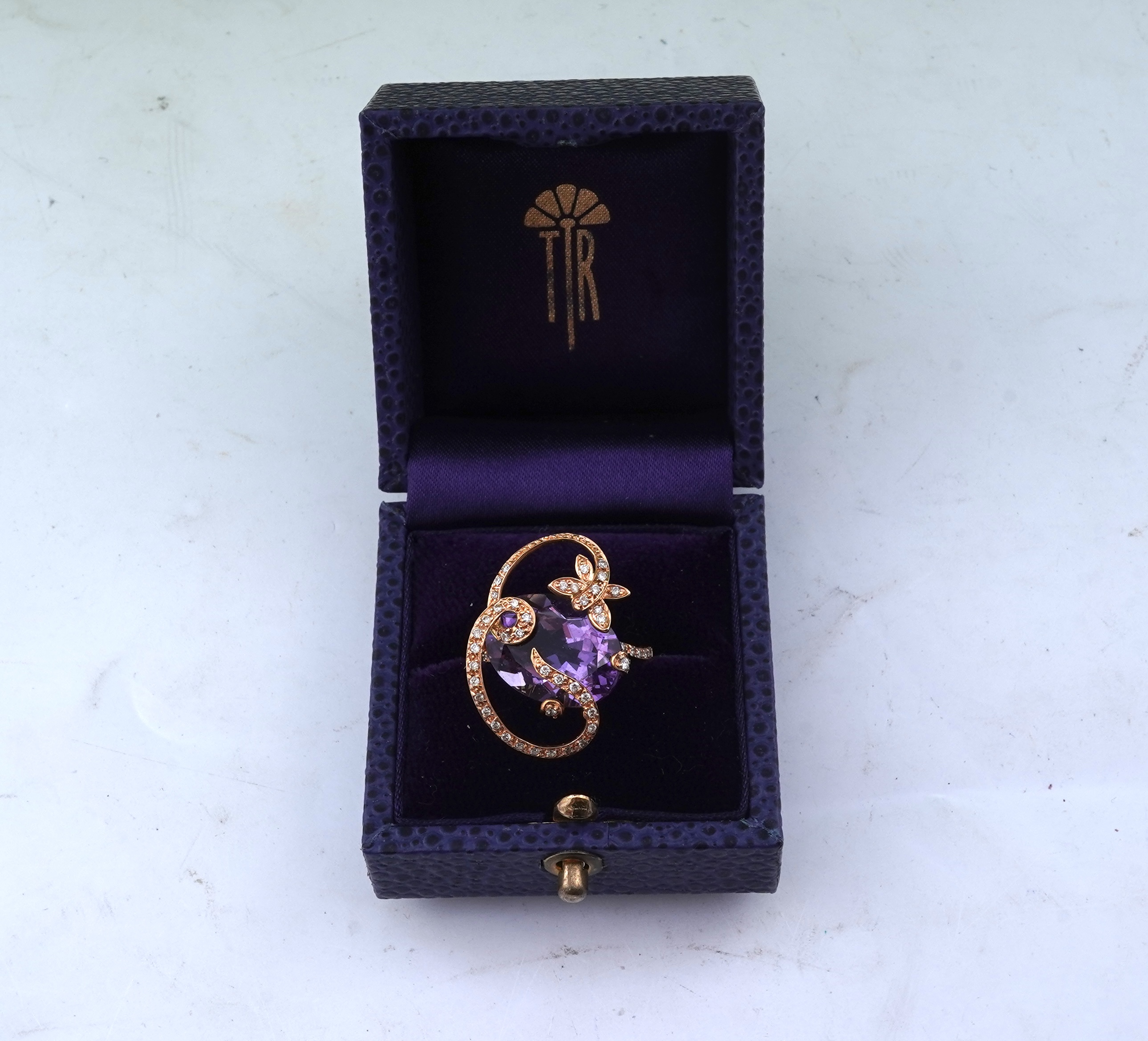 An amethyst and diamond ring